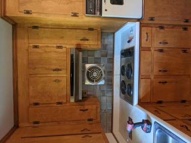 refinished kitchen cabinets around stove